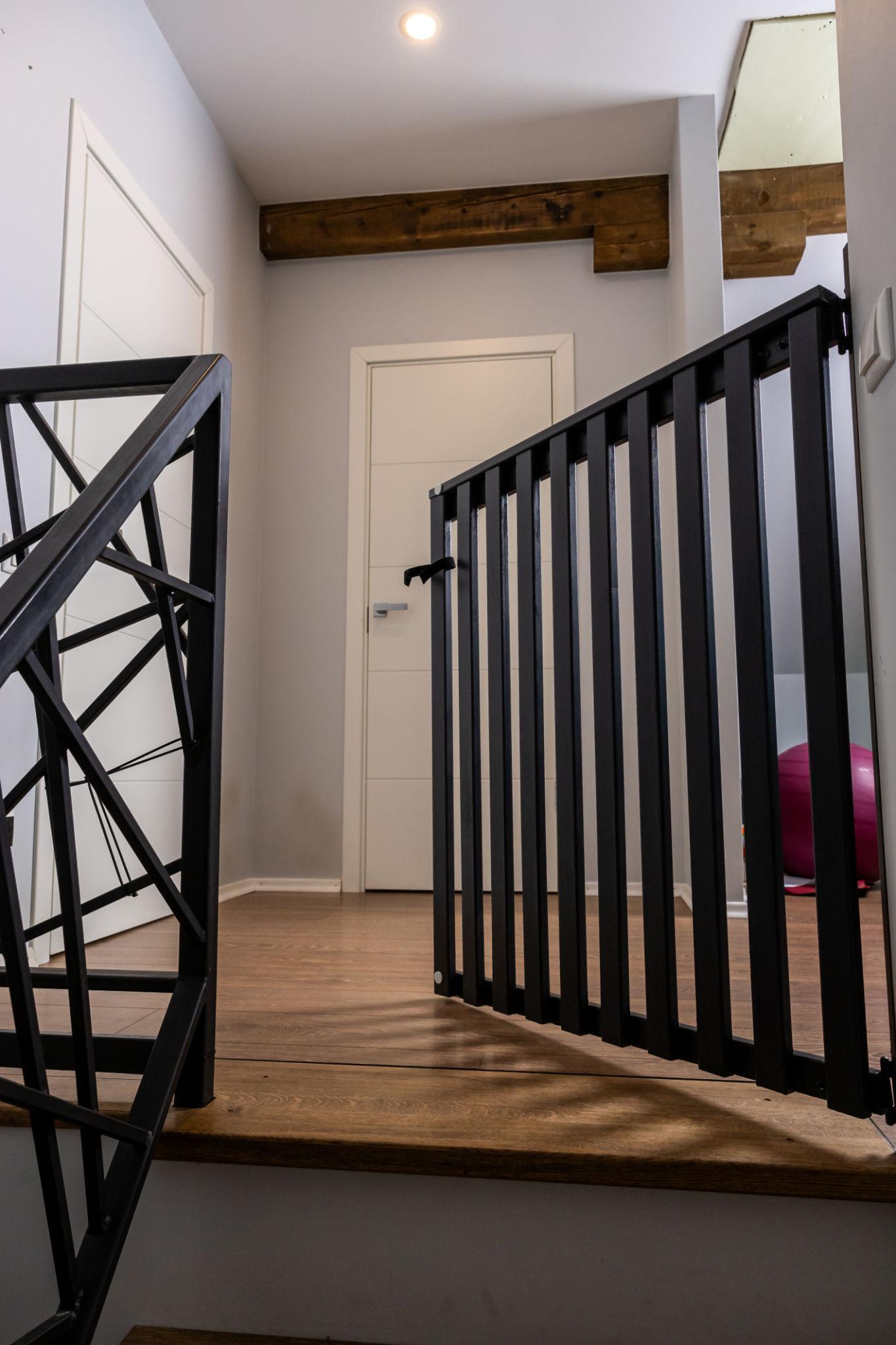 Custom black steel staircase and landing guardrails