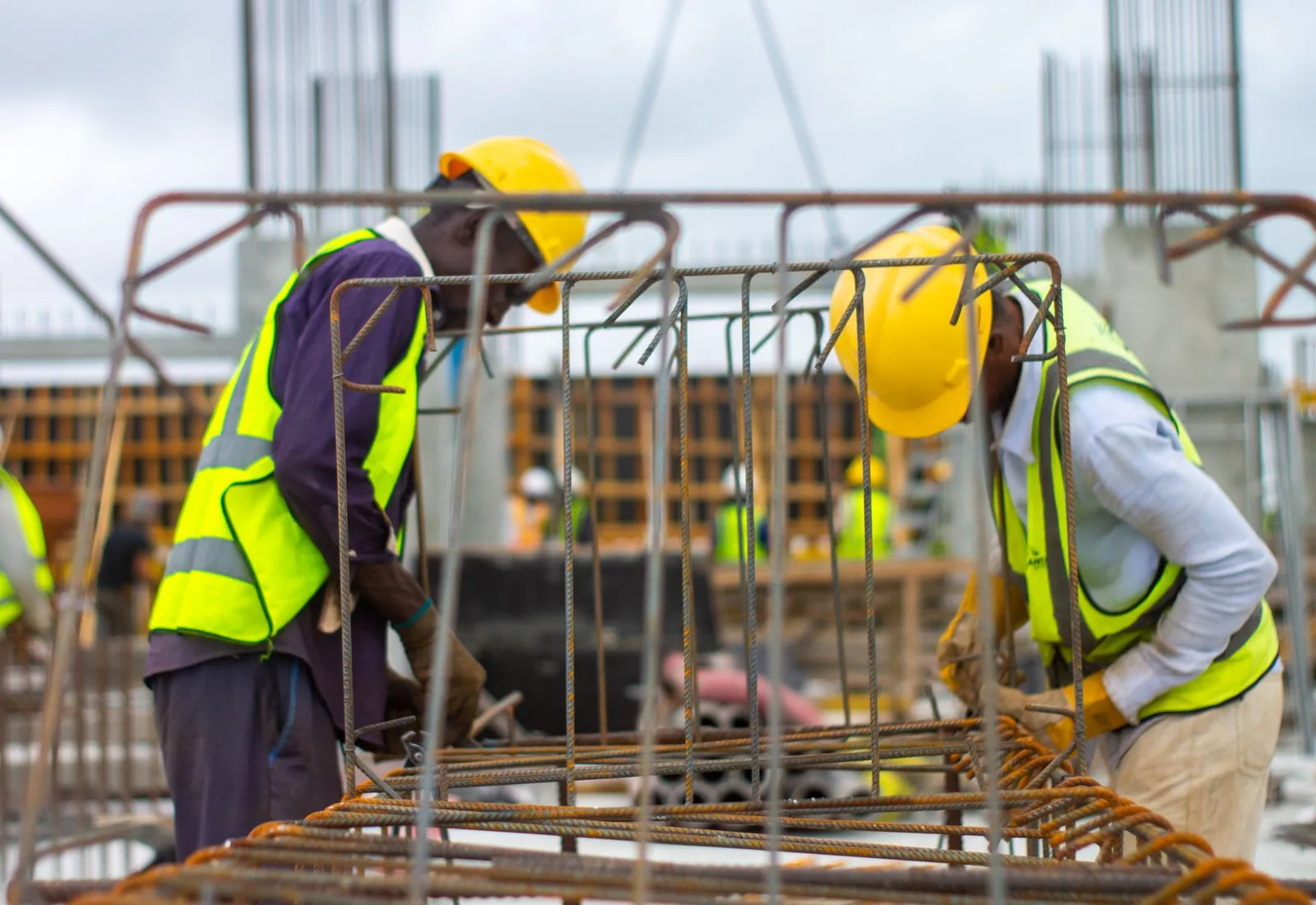 Construction team working with reinforced steel at a commercial job site
