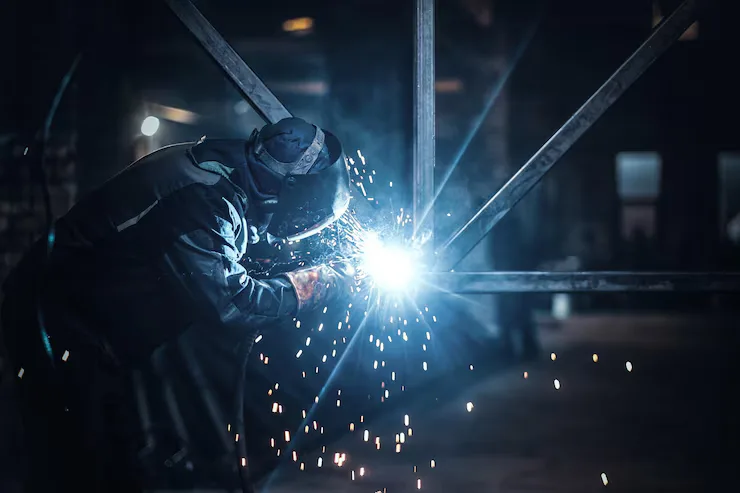 AJs Contracting welder fabricating a steel structure