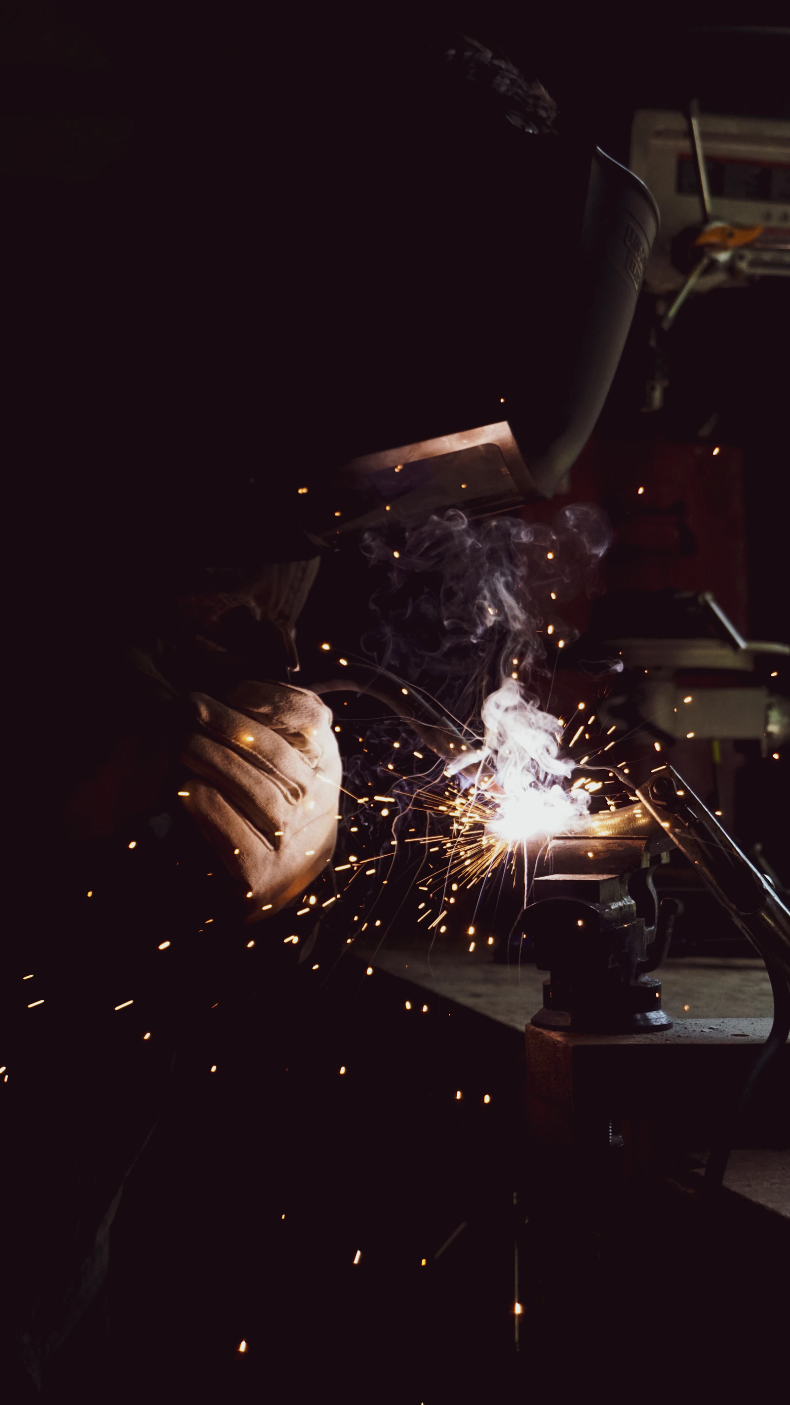 Welder fabricating steel for a contract project
